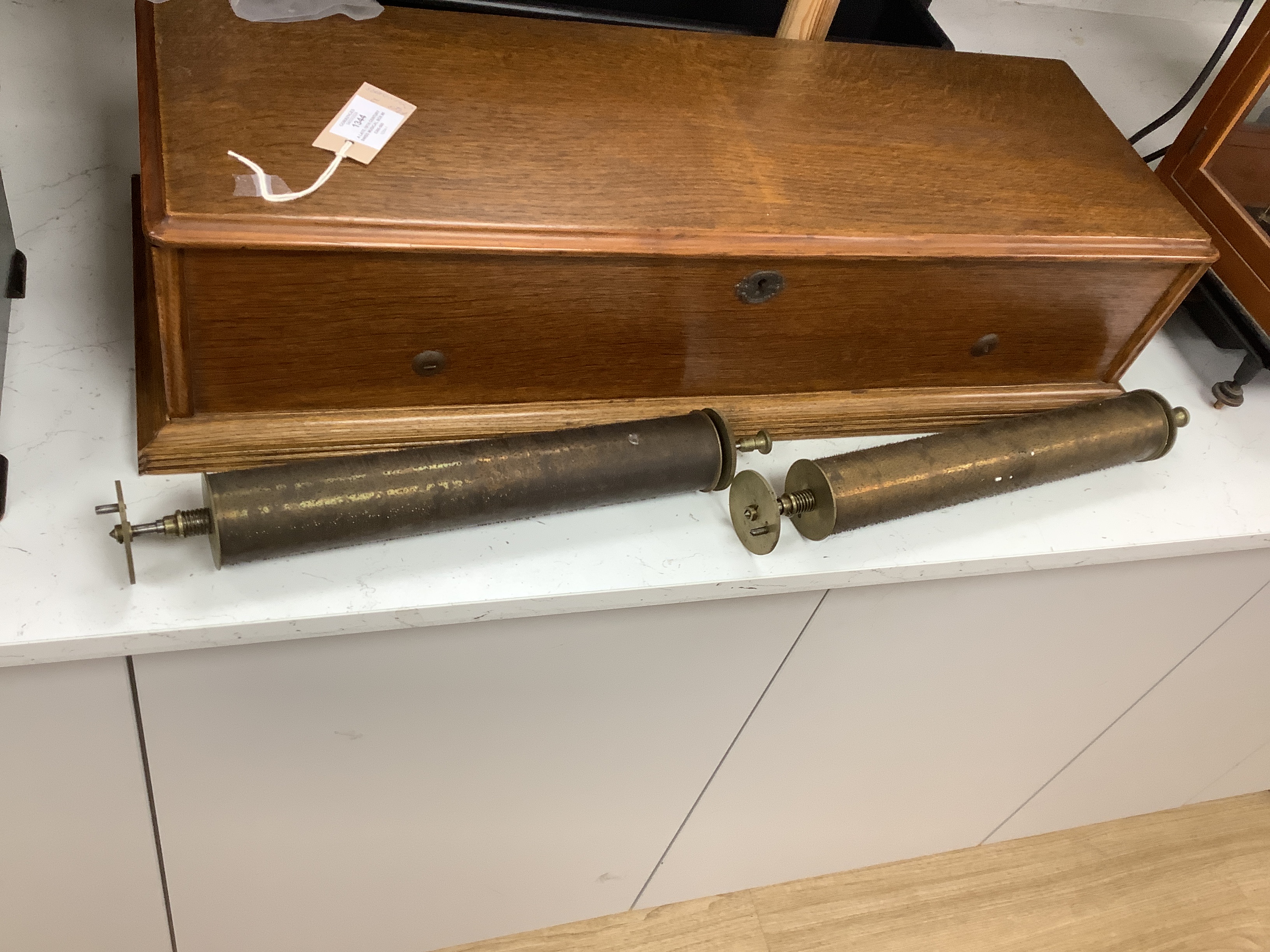 A late 19th century Swiss musical box with 92 tooth comb (one tooth broken and missing), with eight tune 13 inch cylinder and two additional cylinders, the case re-veneered in oak, 79cm wide